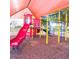 playground with a shaded play structure and slide at 905 Gascony Ct, Kissimmee, FL 34759