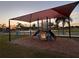 Community playground with shaded play structure at 905 Gascony Ct, Kissimmee, FL 34759