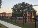 Community playground with playset and climbing structures at 905 Gascony Ct, Kissimmee, FL 34759