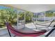 Relaxing screened porch with two hammocks, perfect for enjoying the outdoors at 905 Gascony Ct, Kissimmee, FL 34759