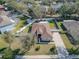 Aerial view showing a house with a fenced backyard and driveway at 1032 Tawny Eagle Dr, Groveland, FL 34736