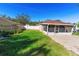 Landscaped backyard with spacious patio and fenced area at 1032 Tawny Eagle Dr, Groveland, FL 34736