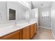 Double vanity bathroom with a shower at 1032 Tawny Eagle Dr, Groveland, FL 34736