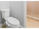 Modern bathroom with a toilet and shower at 1032 Tawny Eagle Dr, Groveland, FL 34736