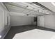 Spacious two-car garage with painted floor and ample storage at 1032 Tawny Eagle Dr, Groveland, FL 34736