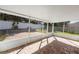 Relaxing screened patio with brick pavers and backyard access at 1032 Tawny Eagle Dr, Groveland, FL 34736