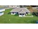 View of the back of the house and backyard at 12876 Sw 64Th Cir, Ocala, FL 34473