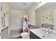 Bathroom with shower/tub combo and dark vanity at 12876 Sw 64Th Cir, Ocala, FL 34473
