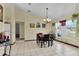 Bright dining room with tile floors and a table for four at 12876 Sw 64Th Cir, Ocala, FL 34473