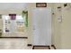 Front entry with white door and tile floor at 12876 Sw 64Th Cir, Ocala, FL 34473