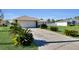 Single-story house with attached garage and manicured lawn at 12876 Sw 64Th Cir, Ocala, FL 34473