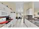 Open kitchen with white appliances and view of dining area at 12876 Sw 64Th Cir, Ocala, FL 34473