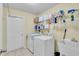 Laundry room with washer, dryer, and utility sink at 12876 Sw 64Th Cir, Ocala, FL 34473