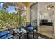 Relaxing screened porch with seating area, overlooking backyard at 14042 Sparkling Cove Ln # 606, Windermere, FL 34786