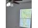 Bright bedroom with ceiling fan and window at 14716 Yorkshire Run Dr, Orlando, FL 32828