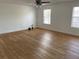 Bedroom with wood-look floors and ceiling fan at 14716 Yorkshire Run Dr, Orlando, FL 32828