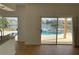 Kitchen with sliding doors opening to a pool and lake view at 14716 Yorkshire Run Dr, Orlando, FL 32828