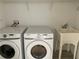 Laundry room with Samsung washer and dryer, and utility sink at 14716 Yorkshire Run Dr, Orlando, FL 32828