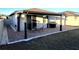 Brick paved patio with covered seating area and grill at 161 Andreas St, Winter Haven, FL 33881