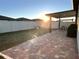 Spacious backyard with patio, covered lanai, and grill at 161 Andreas St, Winter Haven, FL 33881