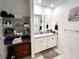 Bathroom with double vanity, granite countertop, and linen closet at 161 Andreas St, Winter Haven, FL 33881