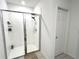 Walk-in shower with glass enclosure and tiled flooring at 161 Andreas St, Winter Haven, FL 33881