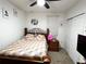 Bright bedroom with a double bed, ceiling fan, and ample closet space at 161 Andreas St, Winter Haven, FL 33881