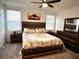Spacious bedroom with wood bed frame and window blinds at 161 Andreas St, Winter Haven, FL 33881
