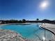 Inviting community pool with ample seating on a sunny day at 161 Andreas St, Winter Haven, FL 33881