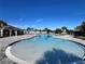Community pool with a shallow wading area and lounge chairs at 161 Andreas St, Winter Haven, FL 33881