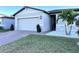 One-story house with a two-car garage and landscaped front yard at 161 Andreas St, Winter Haven, FL 33881