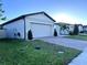 One story home with a two-car garage and well-manicured lawn at 161 Andreas St, Winter Haven, FL 33881