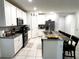 Modern kitchen with granite countertops and stainless steel appliances at 161 Andreas St, Winter Haven, FL 33881