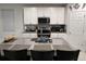 Modern kitchen with granite countertops and stainless steel appliances at 161 Andreas St, Winter Haven, FL 33881