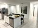 Modern kitchen with granite island and stainless steel appliances at 161 Andreas St, Winter Haven, FL 33881