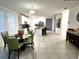 Bright kitchen with island, stainless steel appliances, and dining area at 161 Andreas St, Winter Haven, FL 33881