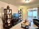 Bright living room with patio access, TV, and comfortable seating at 161 Andreas St, Winter Haven, FL 33881
