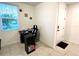Home office with desk, chair, and ample natural light at 161 Andreas St, Winter Haven, FL 33881