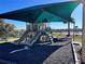 Shaded playground with slides and climbing features at 161 Andreas St, Winter Haven, FL 33881