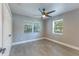 Bright bedroom with ceiling fan and grey vinyl flooring at 1627 Providence Blvd, Deltona, FL 32725