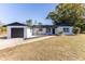 Charming single story home with a newly renovated exterior, featuring a modern black and white color scheme at 1627 Providence Blvd, Deltona, FL 32725