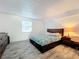 Spacious bedroom with a comfortable bed and neutral decor at 163 Lewfield Cir, Winter Park, FL 32792