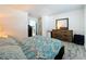 Bright bedroom with wood-look flooring and ample closet space at 163 Lewfield Cir, Winter Park, FL 32792