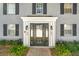 Gray brick building with black shutters and a central entrance at 163 Lewfield Cir, Winter Park, FL 32792
