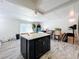 Modern kitchen with an island and stainless steel appliances at 163 Lewfield Cir, Winter Park, FL 32792