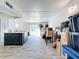 Open living area with kitchen and sliding glass doors at 163 Lewfield Cir, Winter Park, FL 32792