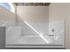 Bathroom with a built-in bathtub and white tile at 1773 Grey Fox Dr, Lakeland, FL 33810