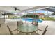 Relaxing pool area with patio furniture and screened enclosure at 1855 Cavalier Ct, Kissimmee, FL 34744