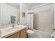 Clean bathroom with single sink vanity, shower/tub combo, and linen closet at 200 Grand Canal Dr, Kissimmee, FL 34759