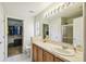 Bathroom features a large vanity and walk-in shower at 200 Grand Canal Dr, Kissimmee, FL 34759